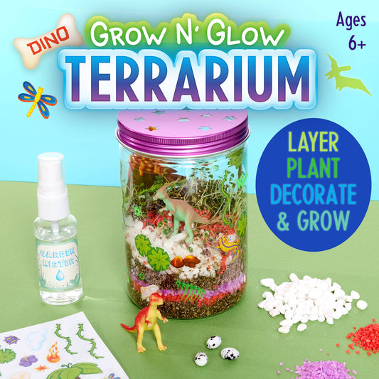 Grow N' Glow Terrarium kit with a jar, spray bottle, and dinosaur figurine on a green background.
