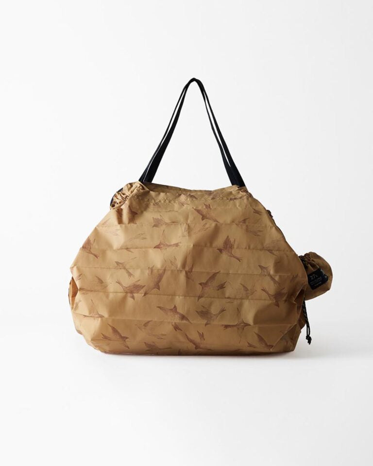 Brown drawstring bag with black handles on a white background