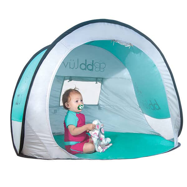 Child playing inside a teal and gray tent with 'bbluv' branding.