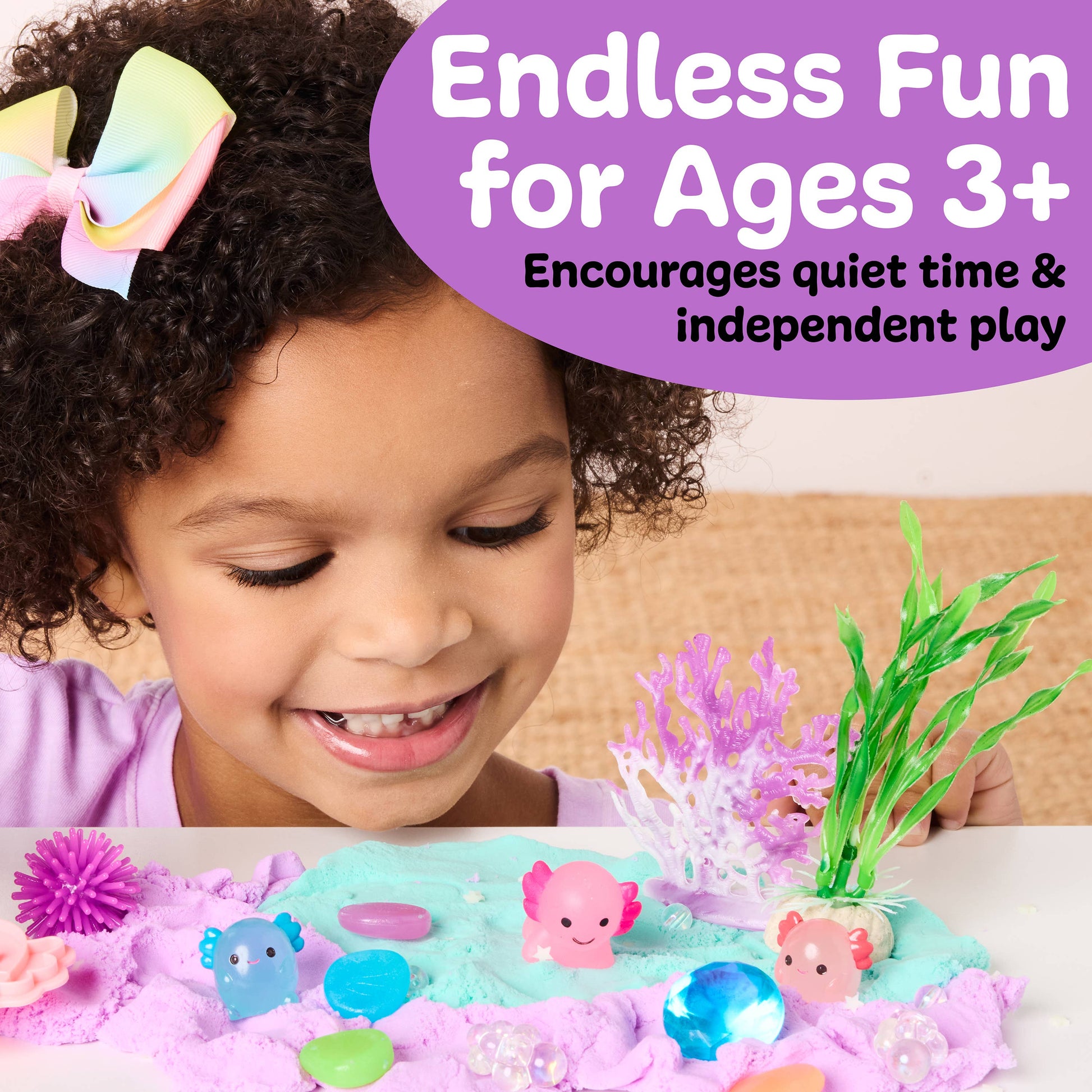 Child playing with a toy set on a table, with text about its suitability for ages 3 and up.