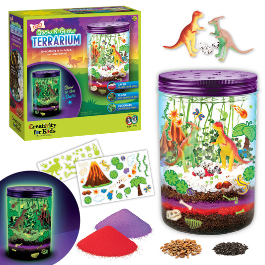 Grow and Glow Terrarium kit with dinosaur figures, packaging, and materials on a white background