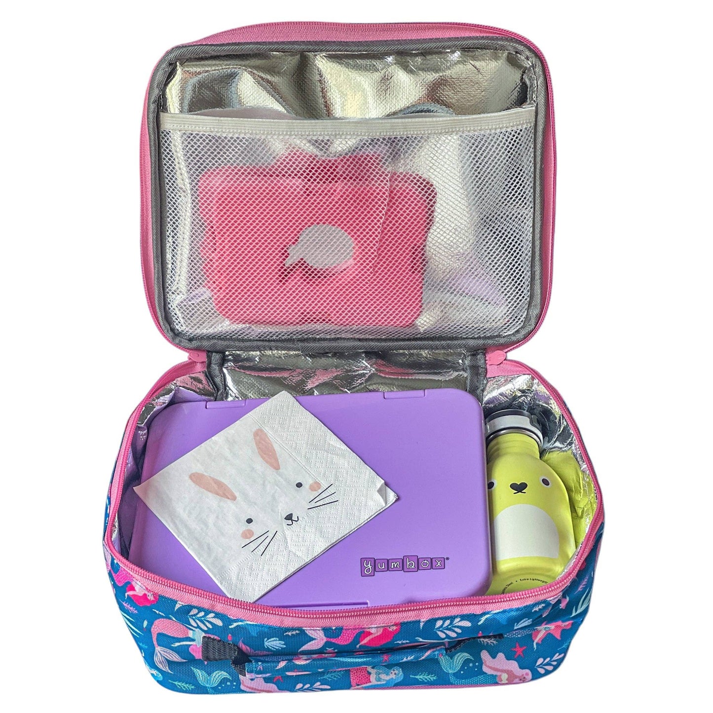 Purple Yumbox inside a lunch bag on a white background