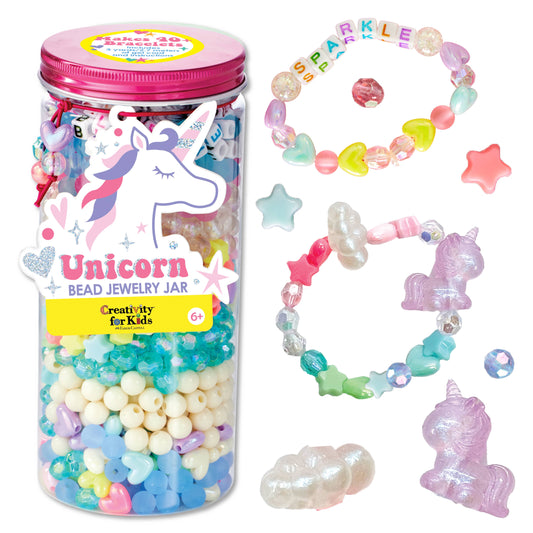 Unicorn bead jewelry jar with colorful beads and accessories on a white background